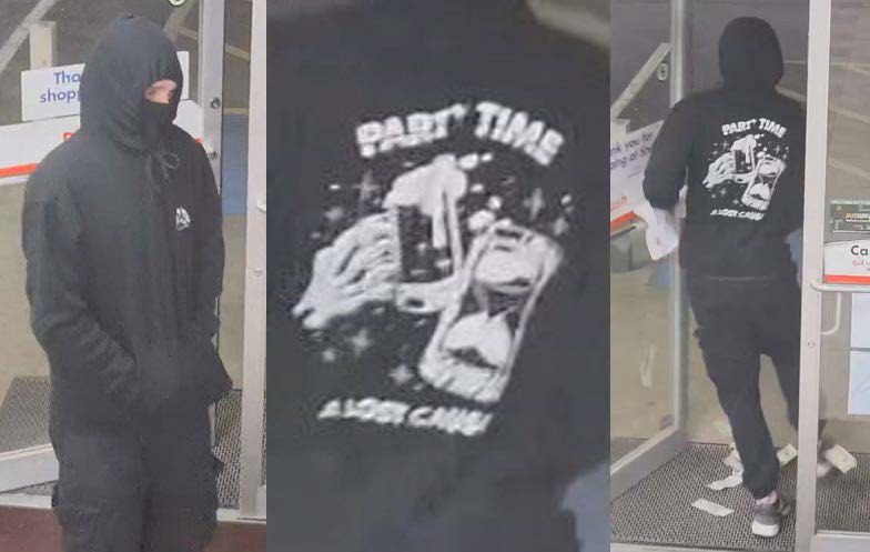 Suspect in the photo is a white male wearing all-black clothing and a hooded sweatshirt with a graphic and the phrases “PARTY TIME” and “A LOST CAUSE” on the back.